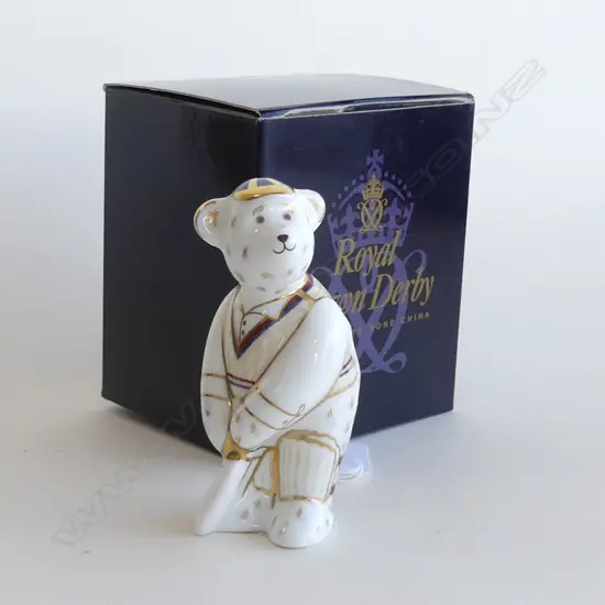 A Royal Crown Derby porcelain paperweight mini Bear Cricketeer